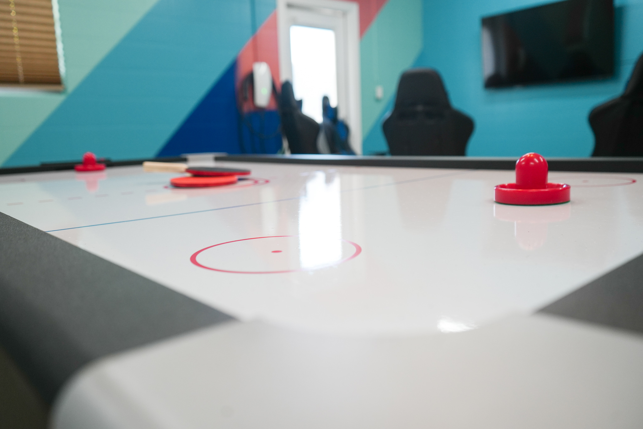 Get ready for some friendly competition with this exciting air hockey table.