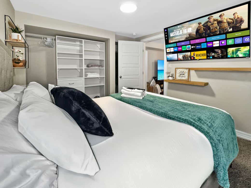 Modern Bedroom with Smart TV and Built-In Closet