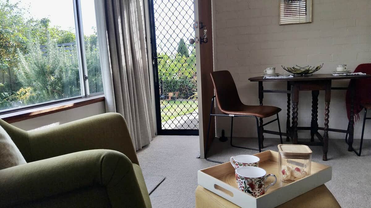 The lounge/dining room has a lovely view of the garden and Mt Wellington.  Enter from the garden side gate.