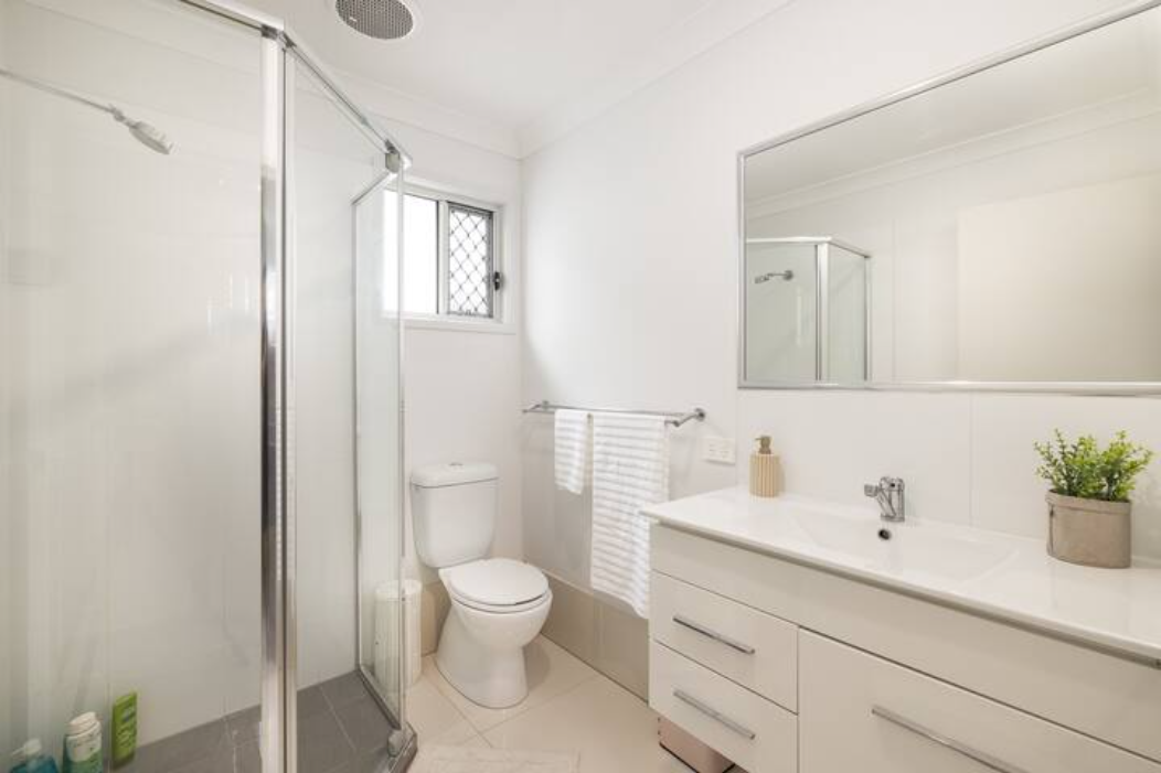 Bathroom: Stylish bathroom with walk-in shower, vanity, and clean finishes 
