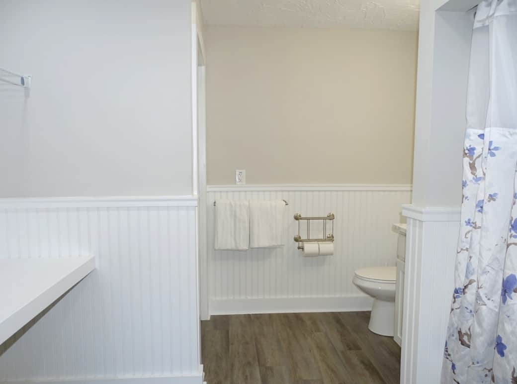 Large bathroom with tub, shower and laundry