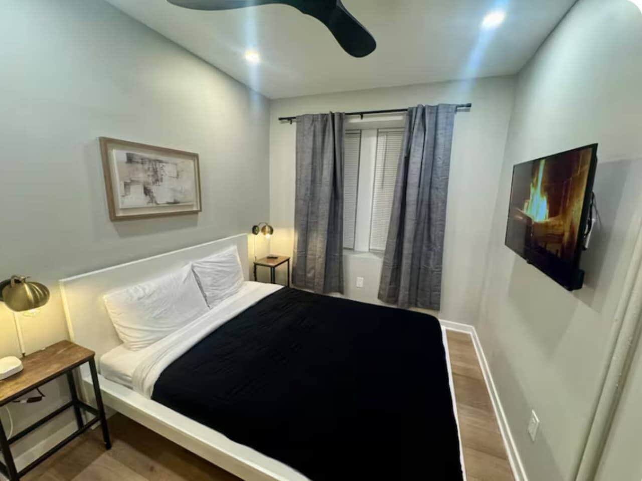 This comfortable bedroom includes a queen bed, flat-screen TV, ceiling fan, darkening curtains, a side table, USB charging, lamp, and a spacious closet for all your storage needs.
