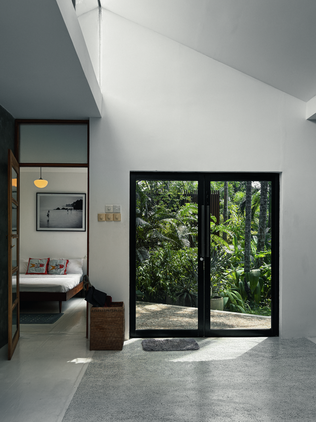 Entrance into the living room. Glass doors open to the garden.
