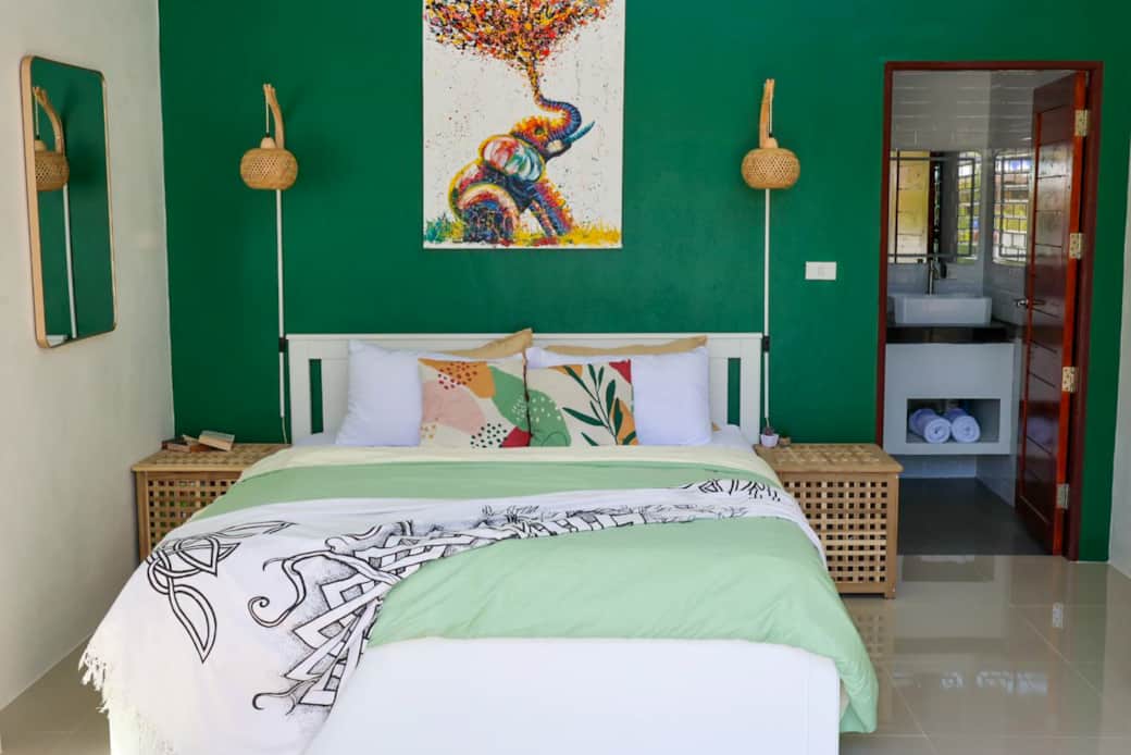 Escape to the master bedroom, where you can watch the sunrise over the pool
