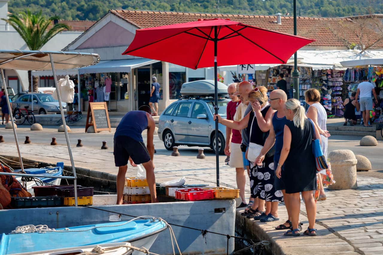 Buy the freshest fish possible, plus locally made wine and olive oil