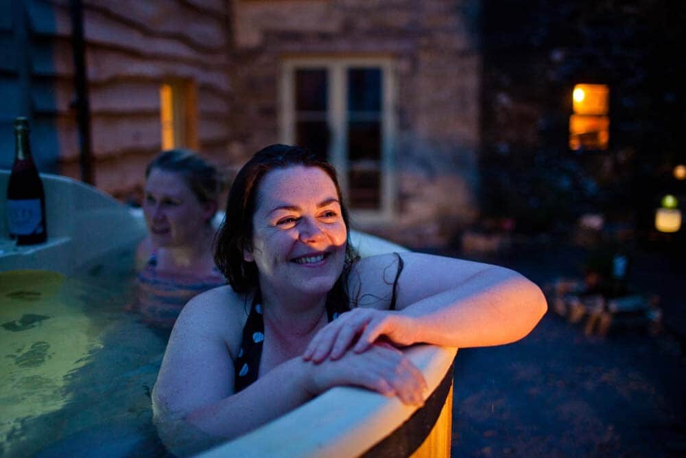 Enjoying the private wood-fired hot tub after dark