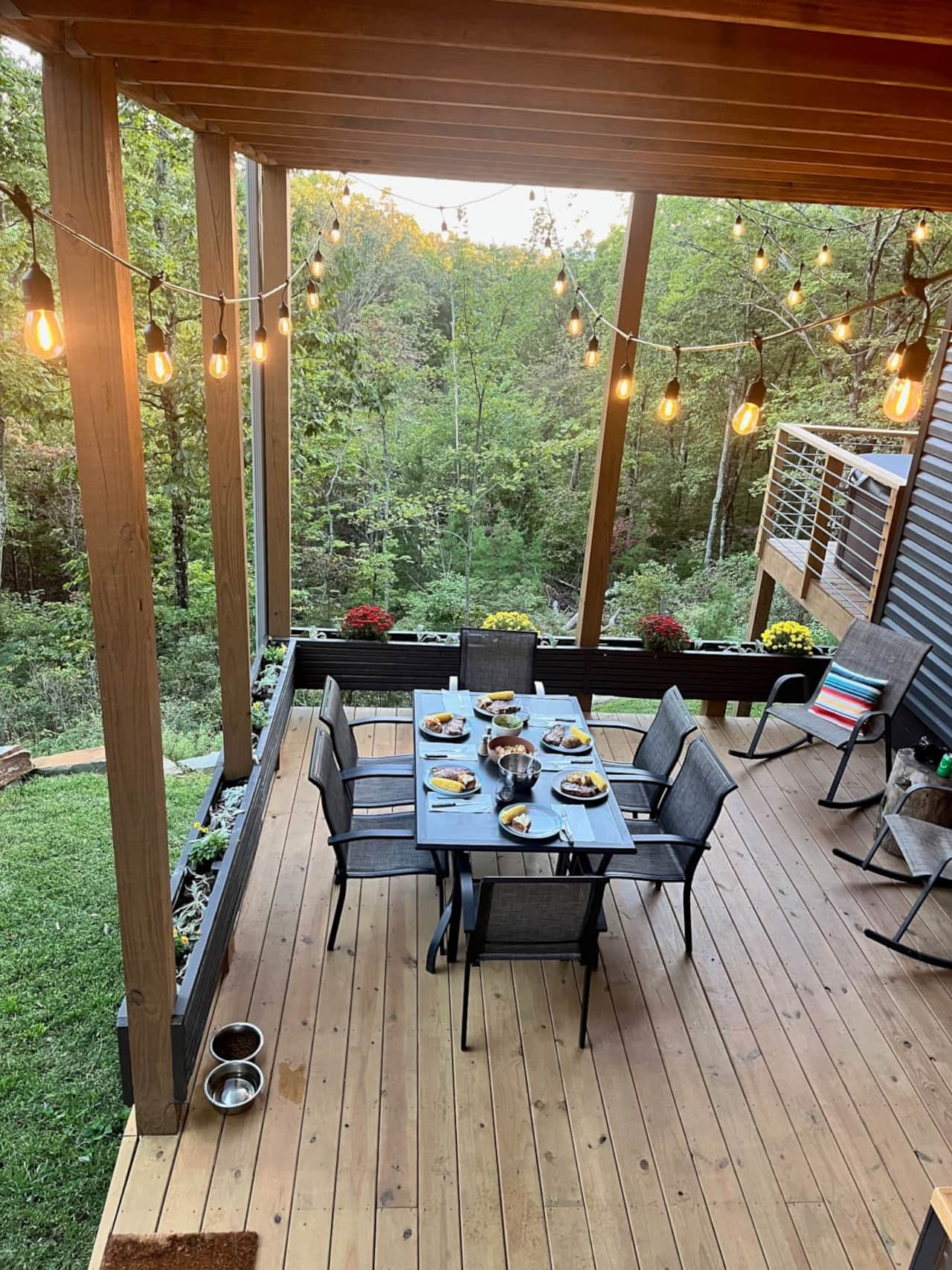 Outdoor kitchen with grill, sink, fridge & prep area
