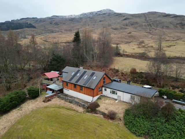 Strathfillan Lodge and garden beneath the surrounding Highland mountains
