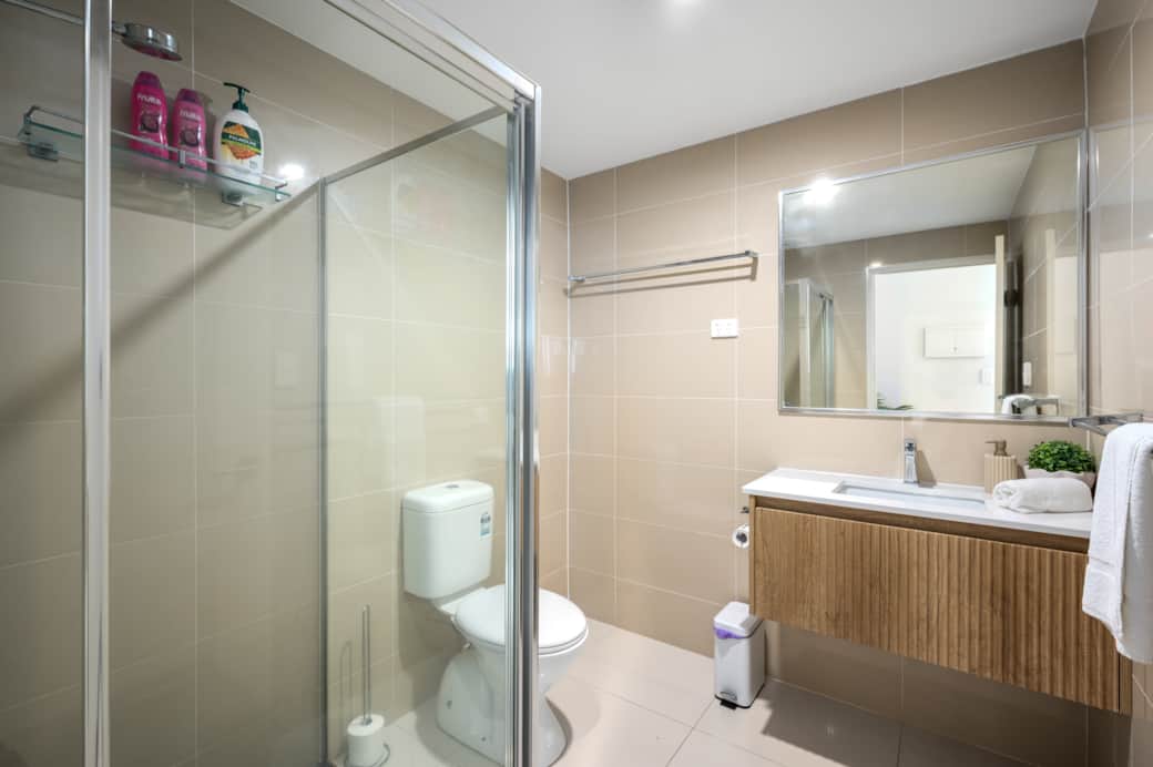 Bathroom: Stylish bathroom with walk-in shower, vanity, and clean finishes 