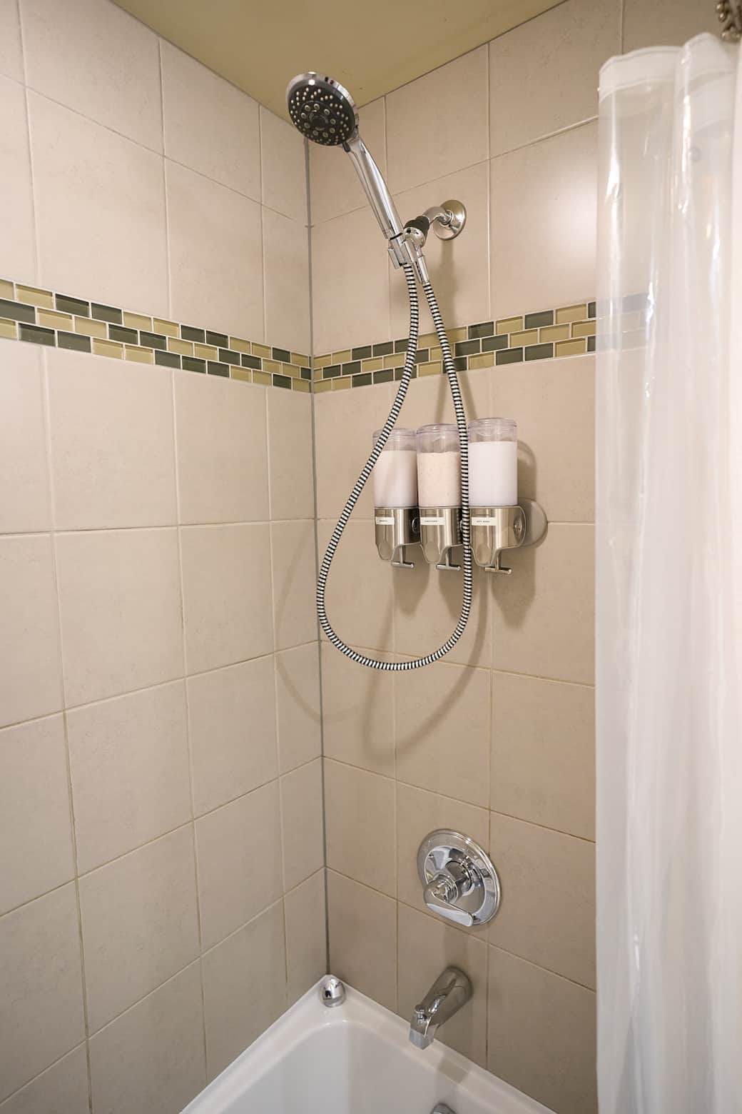 The shower is stocked with shampoo, conditioner, and body wash The shower is stocked with shampoo, conditioner, and body wash