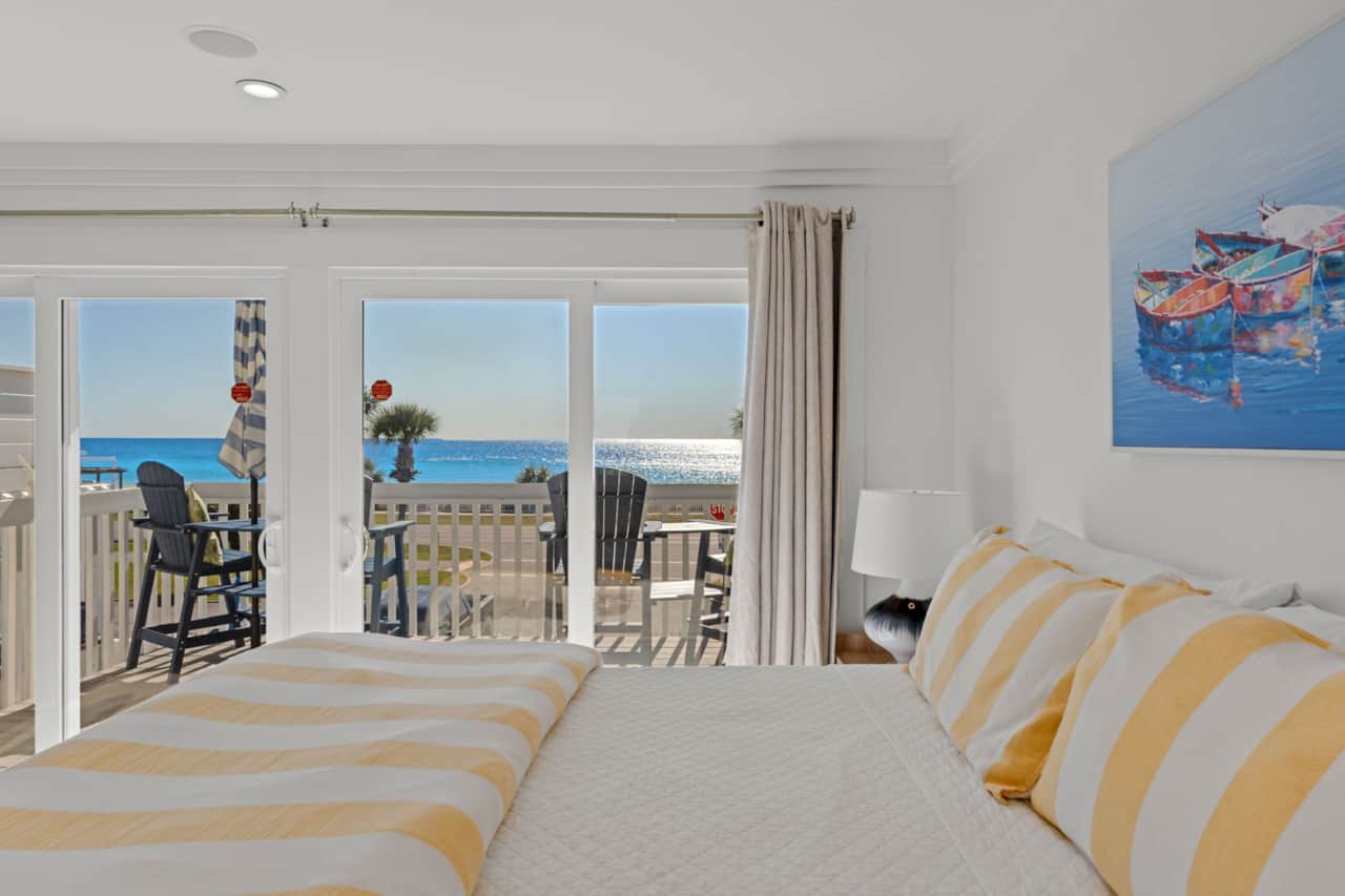 King primary bedroom with private balcony and Gulf views