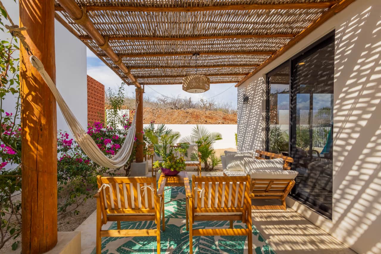 Outdoor sofa with hammock and hanging lamps