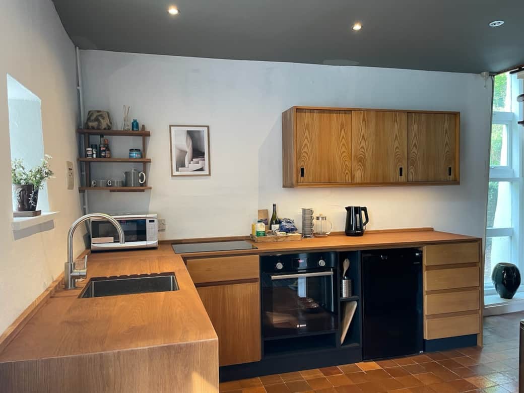Spotlight switches for the kitchen are behind the welsh dressor. under cabinet lighting is operated by proximity sensor switch under the left side of the wall cabinet wave your hand to turn this on or off.