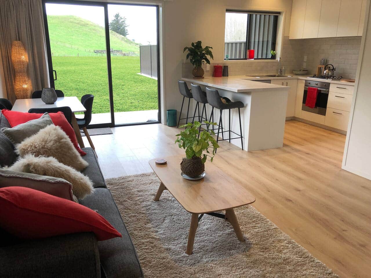 Your home away from home... enjoy a cup of tea or glass of wine while the kids play outside .. check out the stars at night.. with no light pollution and just the moreporks to lull you to sleep!