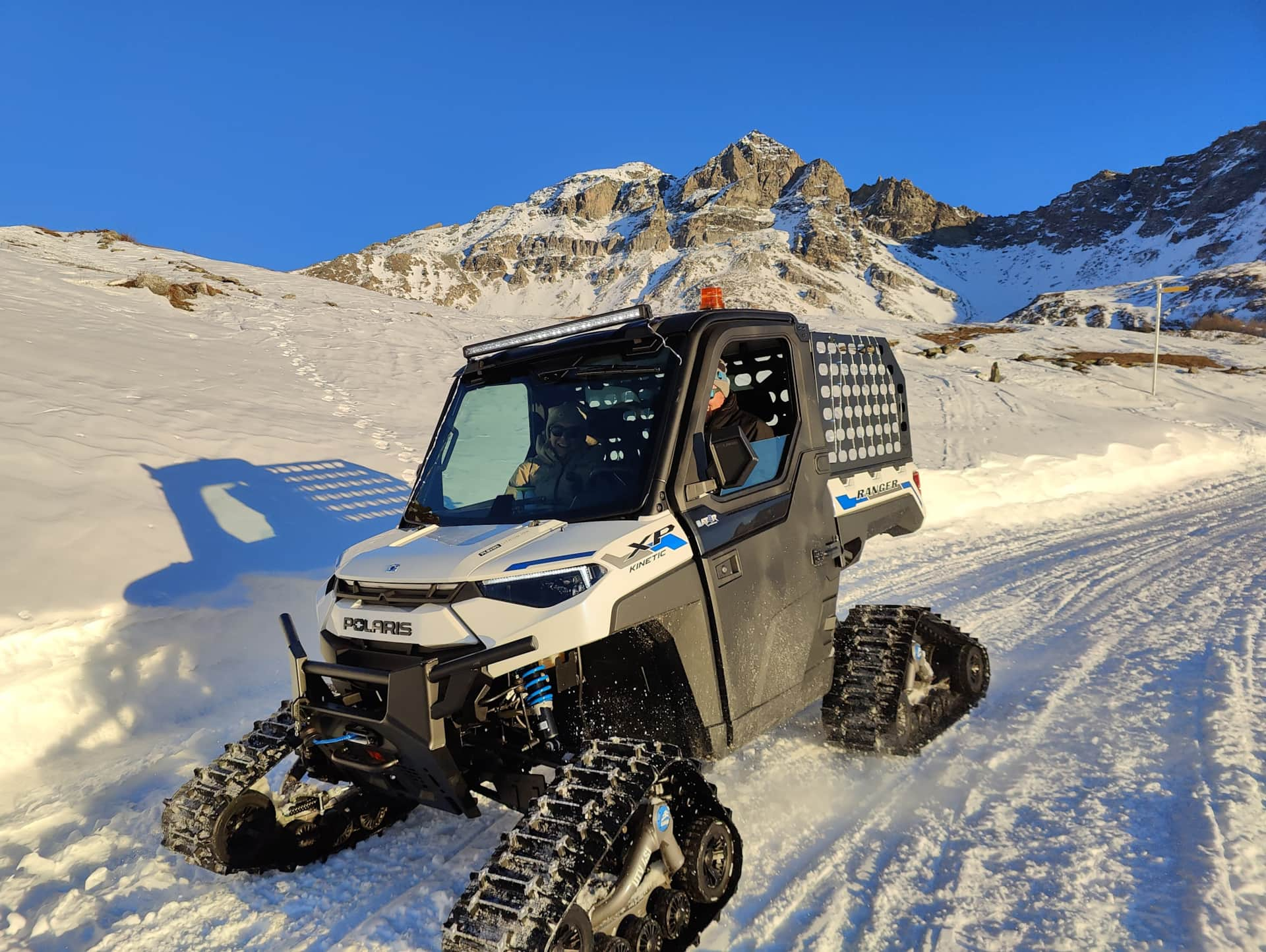 Alpine excursion by electric Polaris on the trails above the chalet