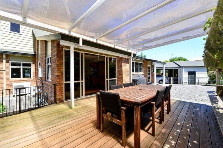 Step outside to a spacious sun-drenched deck complete with a 6-seater wooden dining table, perfect for al fresco meals, morning coffee. The clear pergola roof offers shelter from sun and rain, making this outdoor space enjoyable year-round. 