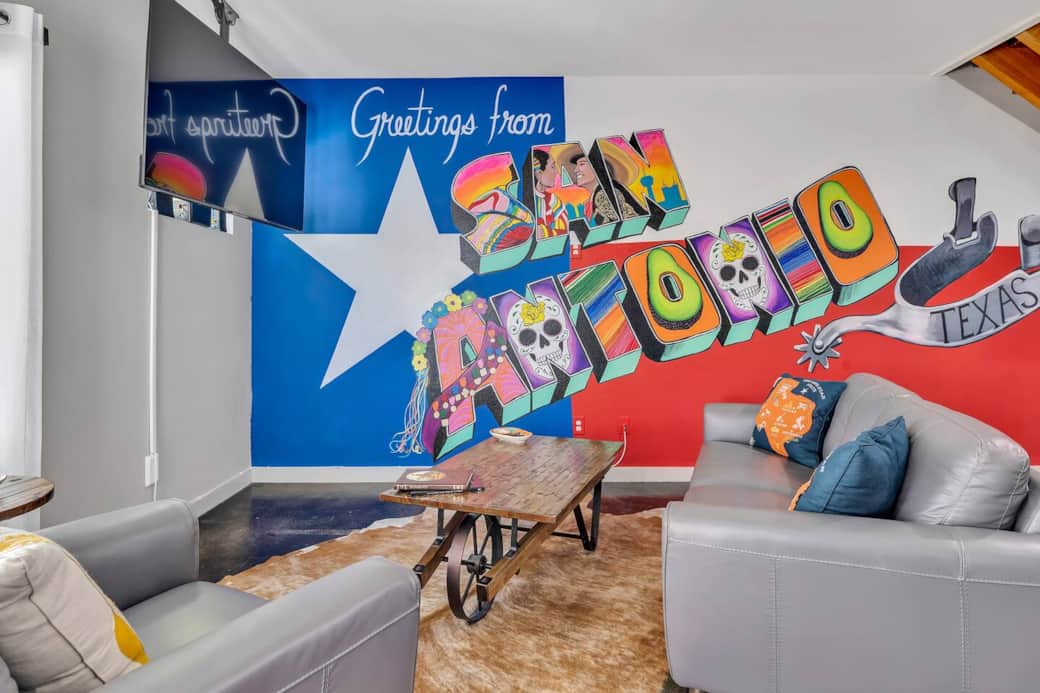A custom-commissioned mural by local street artist GHOST covers the entire wall of the living room! It is a one-of-kind and perfect picture opportunity for you.