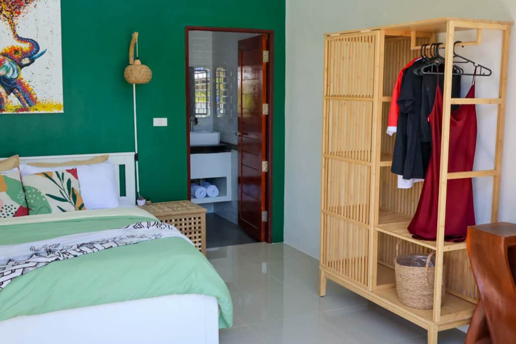 Your luxurious master suite awaits, complete with a private ensuite and a stunning pool view