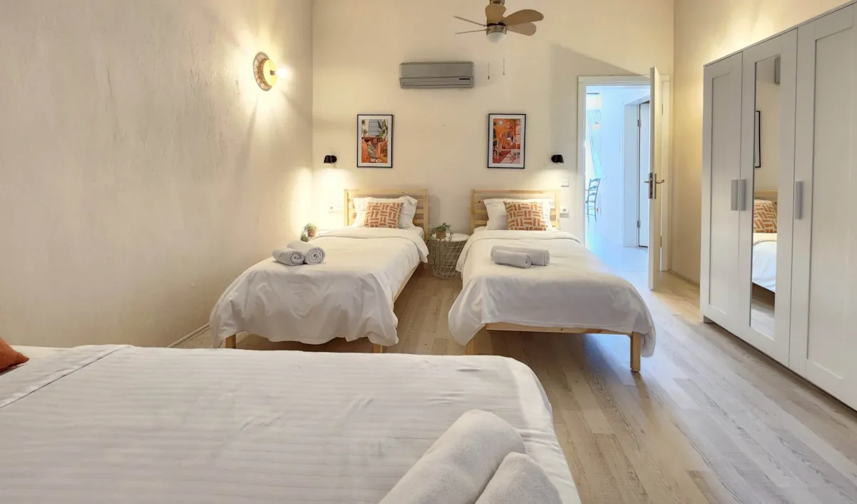 Bedroom with two single beds, a wardrobe, and wall art, Apart Guney 6, Gocek