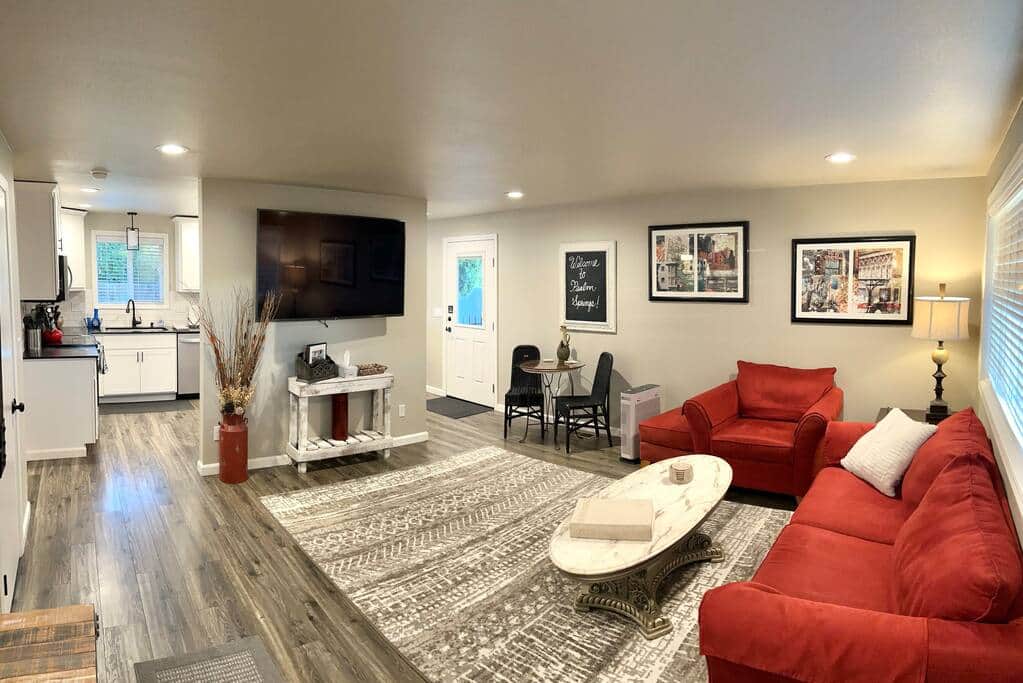 Relax in this remodeled living room with 65” Smart TV with Roku and cable!
