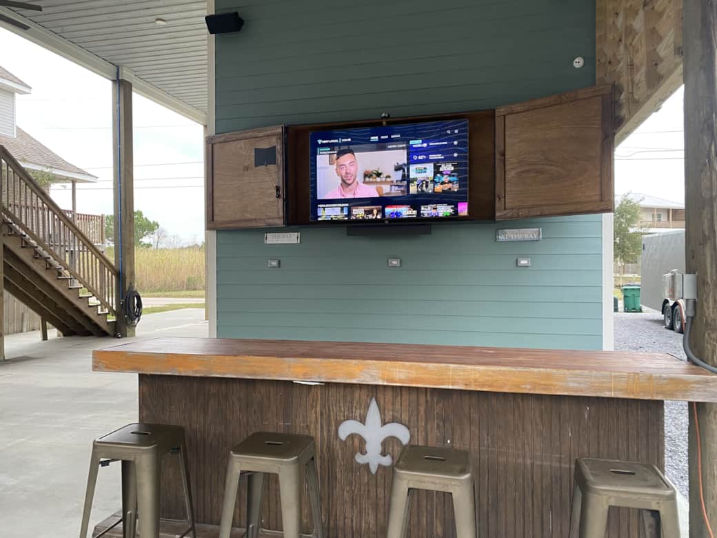 Game-day ready bar and lounge with TV downstairs.