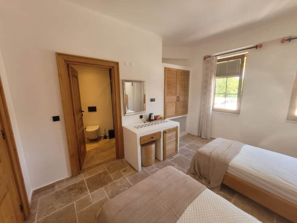 Spacious twin bedded room over looking Ancient Side and across to the ocean. 
Mini fridge tea and coffee facilities, lap top size safe, complimentary toiletries, with full use of our Oasis courtyard overlooking the Grand Bathhouse and ocean views.  