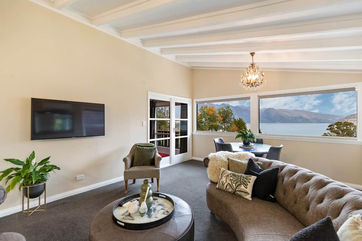 Spacious living room with lake views at Walk to Town 41A Alpine Chalet Lomond Crescent Queenstown