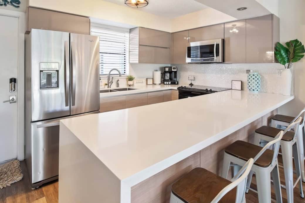 A stylish and functional counter space with room to connect, share meals, and enjoy the artful coastal design