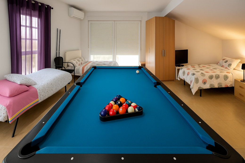 King bed, double bed, and two single beds. Large TV, wardrobe, and bedside table. Sleeps up to 6!