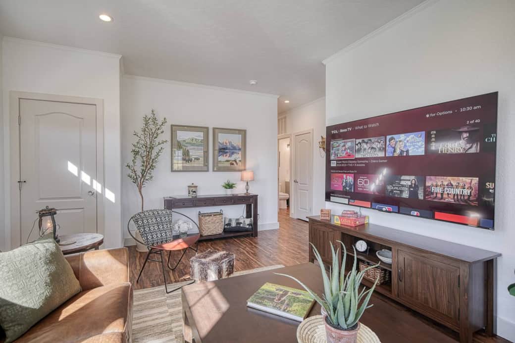 Relax together in this spacious home that's clean, bright, and thoughtfully designed.

The large smart TV is perfect for watching your favorite sports or family movies.  The comfortable furniture invites everyone to gather and make memories together!