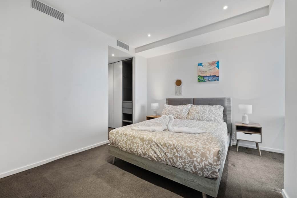 Our bedroom offers a cozy queen-sized bed and an big storage for added convenience. The room is simply decorated, creating a calm and inviting atmosphere. It's the perfect space for guests to relax themselves and feel at home during their stay.