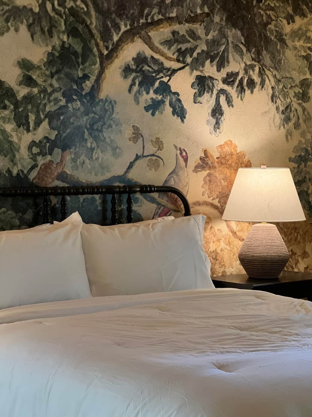 Wake to sunlight filtering through the trees in bedrooms that blend cozy comfort with modern elegance
