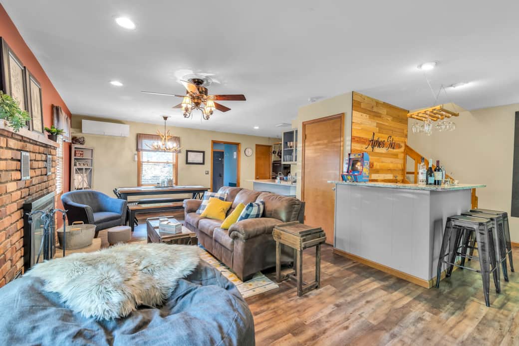 Bright open living room with fireplace, Smart TV, and space for your whole group Bright open living room with fireplace, Smart TV, and space for your whole group