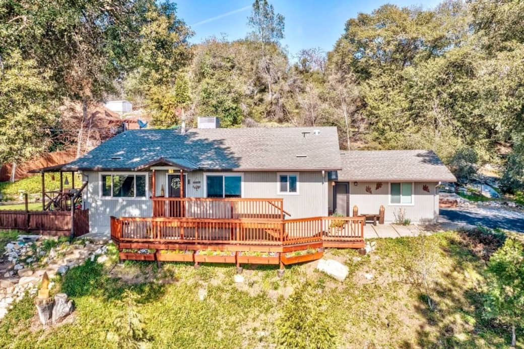 A full shot of the front of the bungalow. Enjoy beautiful mountain views from the front deck and windows.