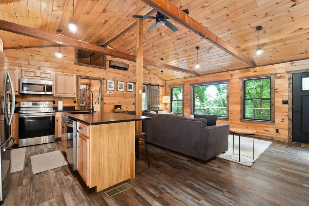 Modern kitchen with dishwasher and living area for conversations even while making meals.