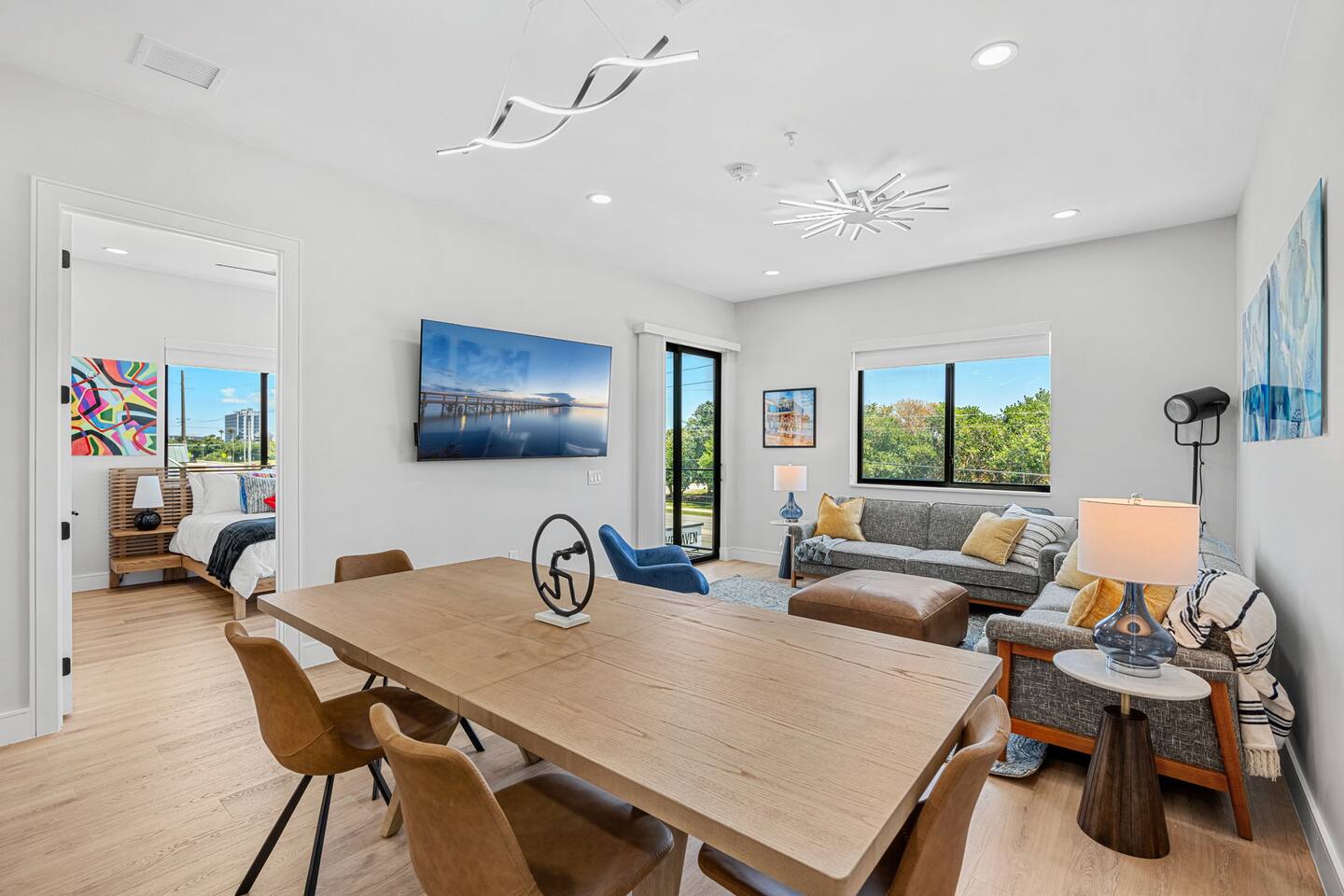 Open layout combining the dining and living area, full of natural light.
