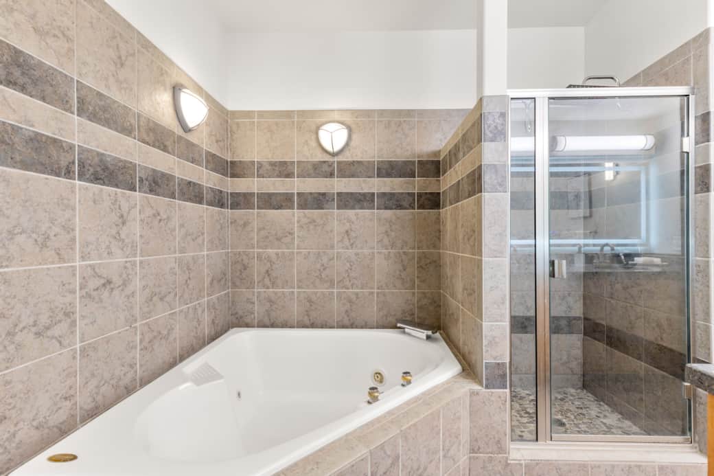 Spa-inspired bathroom with a deep soaking tub for ultimate relaxation.