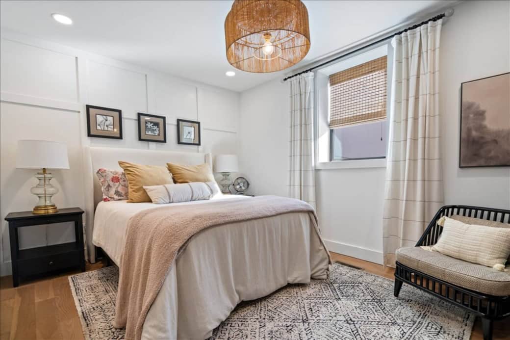 Rest easy on the plush queen bed with luxurious bedding — your cozy retreat after a day in the city.