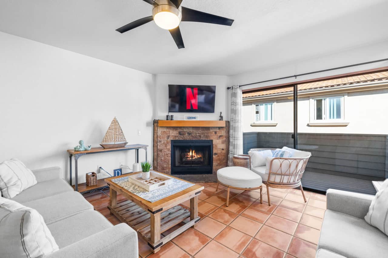 Open Living Area w/ Fireplace  - Access to Balcony 