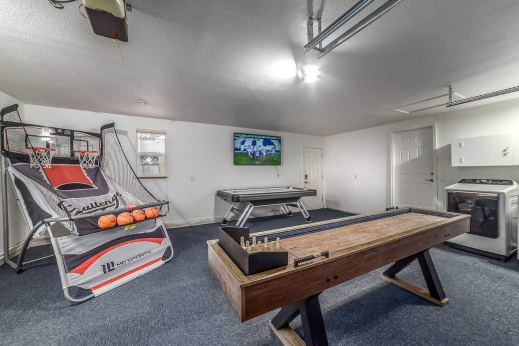 Game room with Arcade basketball game, air hockey table and shuffleboard table. Shuffleboard table can also convert to shuffleboard bowling. Game room with Arcade basketball game, air hockey table and shuffleboard table. Shuffleboard table can also convert to shuffleboard bowling.