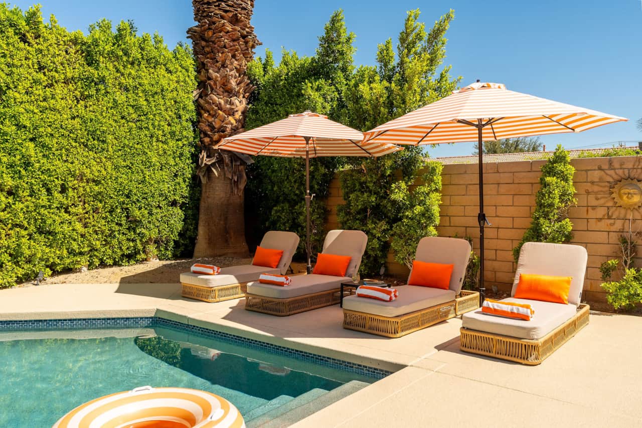 Four comfortable loungers and umbrellas