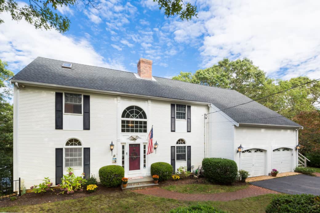 Street view of the house and 3 car driveway
