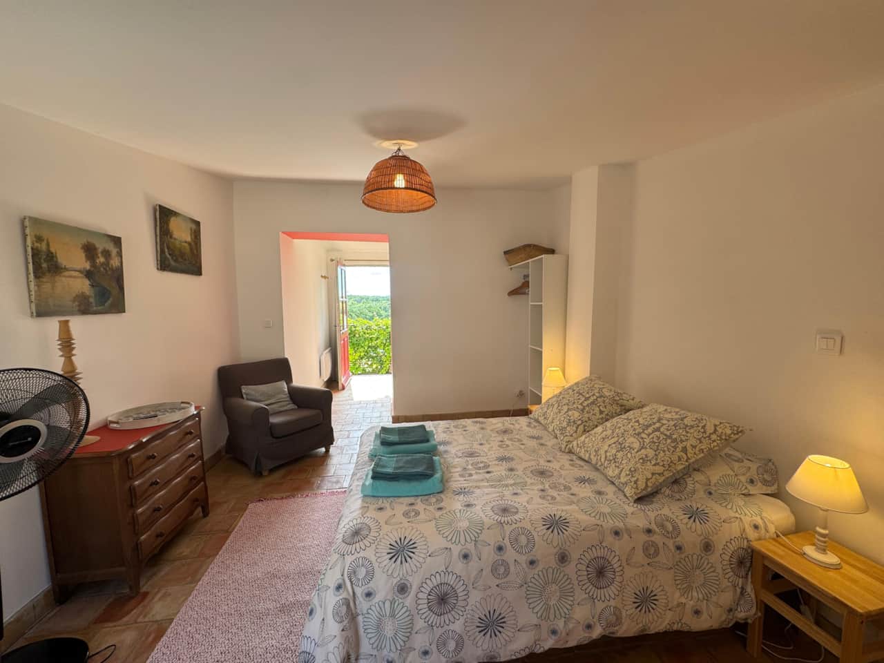 living room, bedroom, double bed, towels, door, fan, dresser