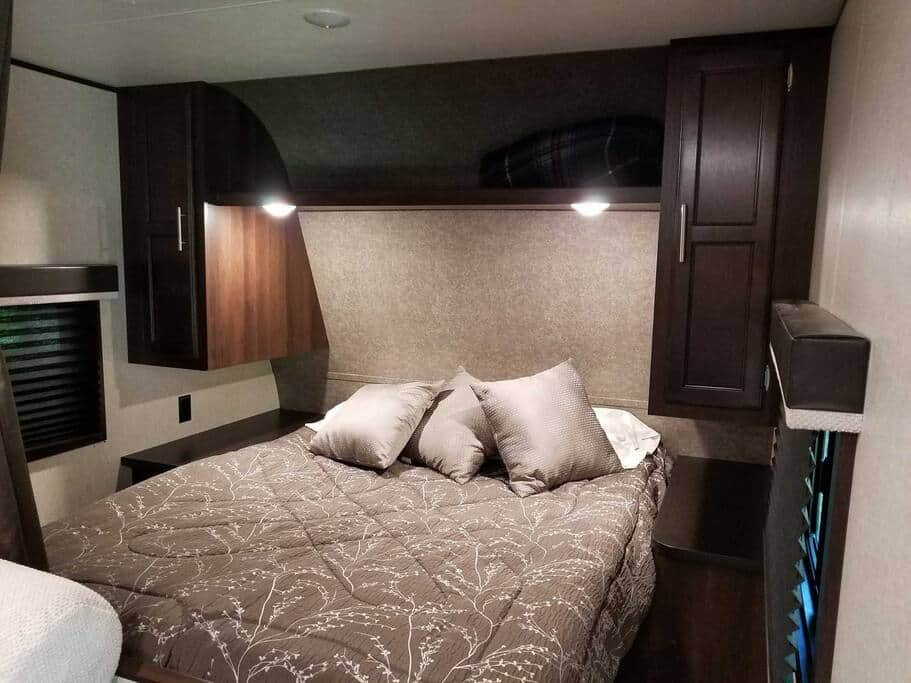 Queen bed with curtain closure for privacy Camper B