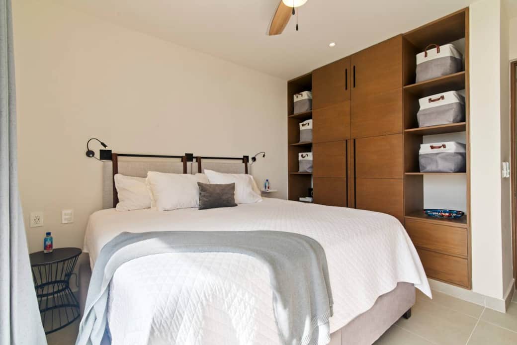 This bedroom also includes a full wardrobe for your use during your stay, a safe for your belongings, and convenient outlets and a light switch right next to the bed.