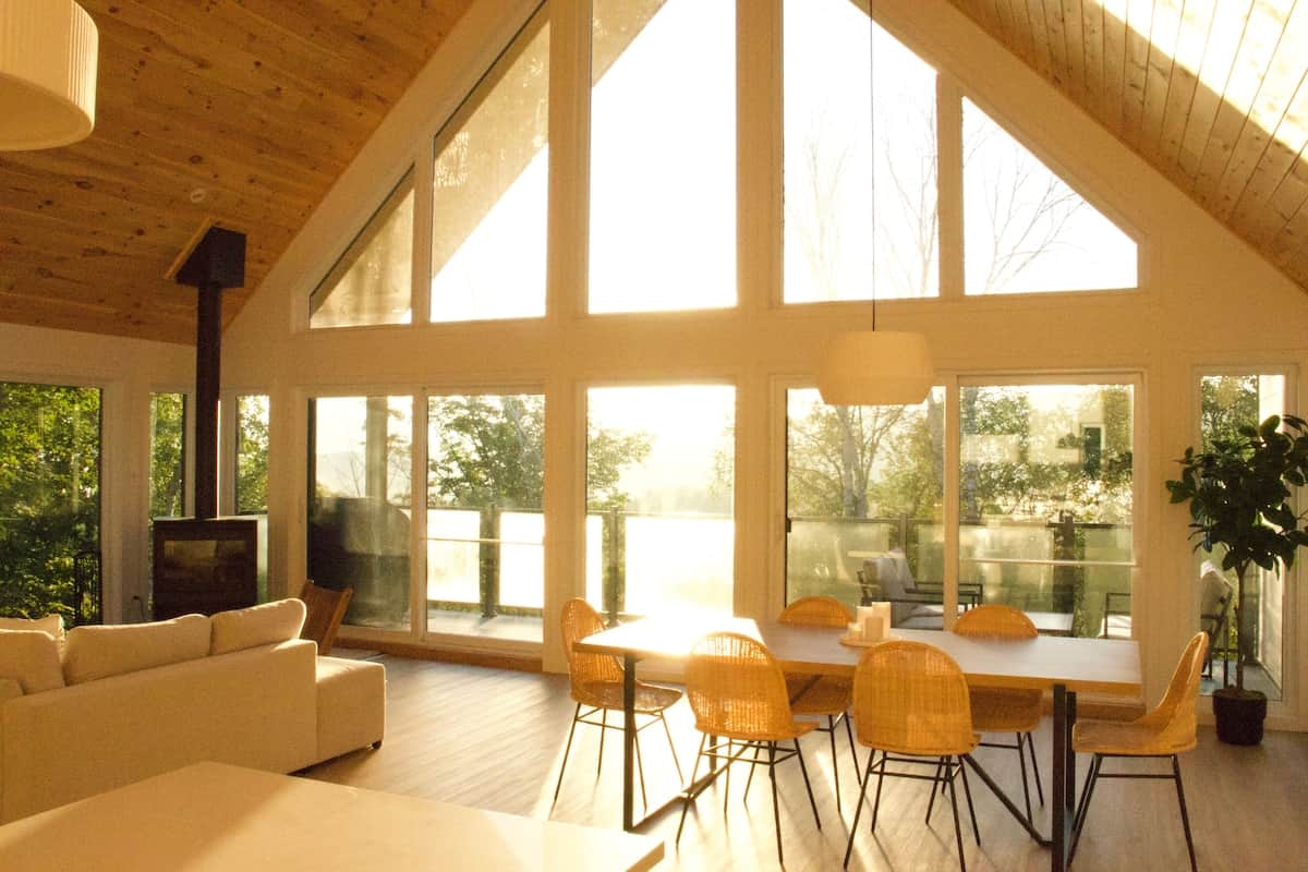 Living room with large windows overlooking the forest, Chalet Le Charlotte