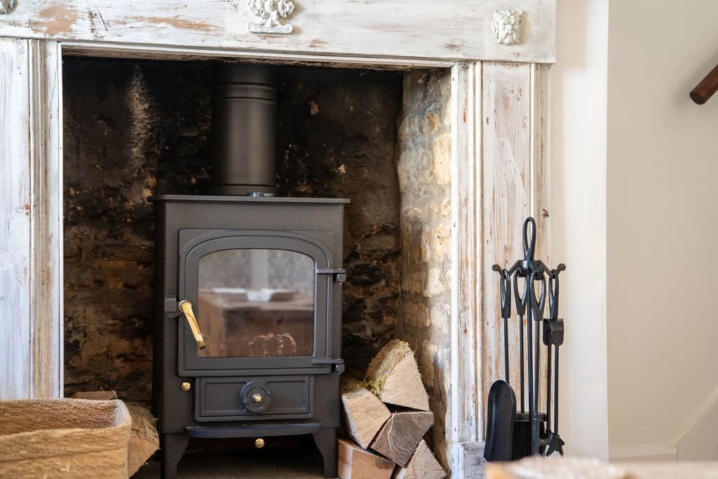 Traditional fireplace and cosy log burner