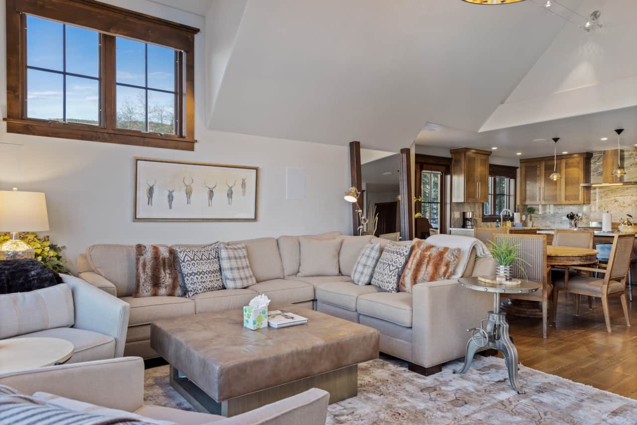 Living room features plenty of seating and a queen sized sleeper sofa