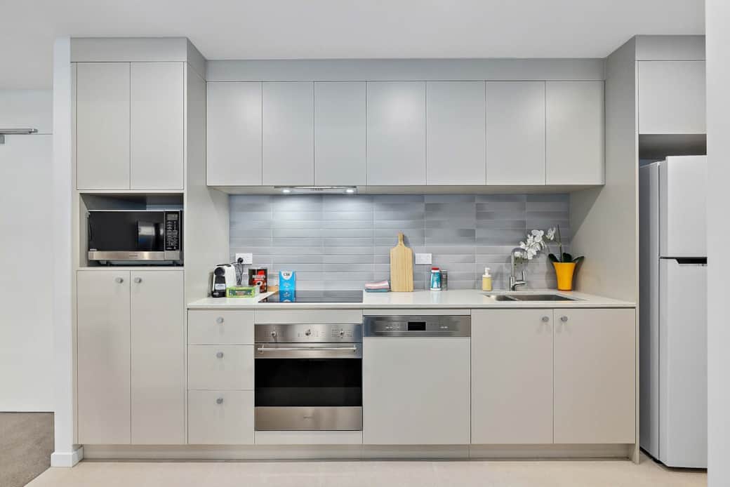 Our modern kitchen is a chef's dream, and the minimalist design creates a bright and inviting space for culinary adventures.. The gas stove and built-in oven are perfect for cooking gourmet meals, while the large refrigerator ensures ample storage