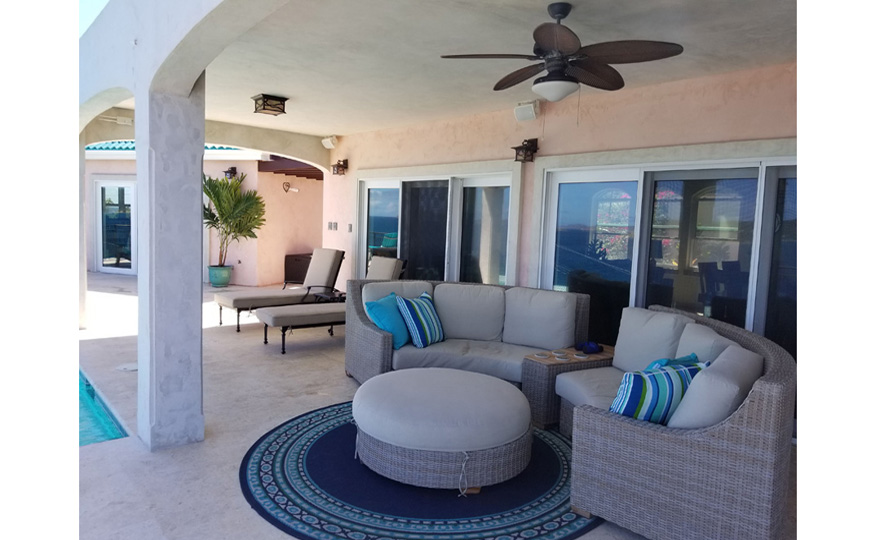 Expansive covered porch and sunny pool patio